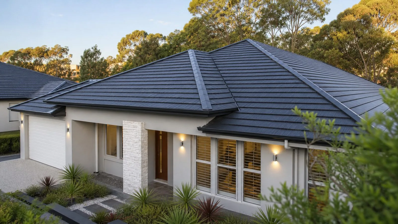 Dark roof tiles showing a consistent visible finish across several slopes